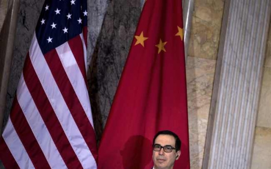 China urges US to drop new sanctions on Chinese companies