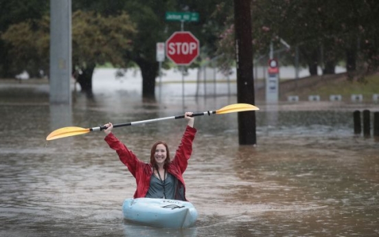 Rescuers pluck hundreds from rising floodwaters in Houston