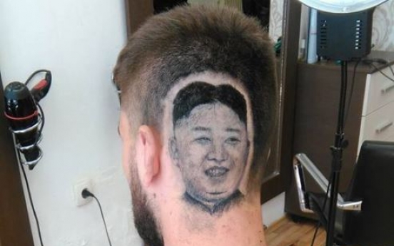 Serbian man shaves his head to enshrine N. Korean leader’s portrait