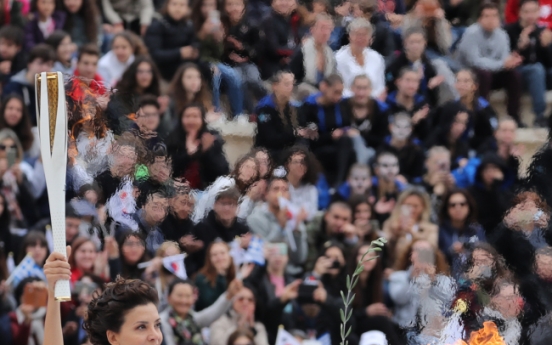 Olympic flame handed over to S. Korean organizers of PyeongChang 2018