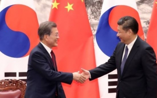 Moon returns home after summit with China's Xi over N. Korea, bilateral ties