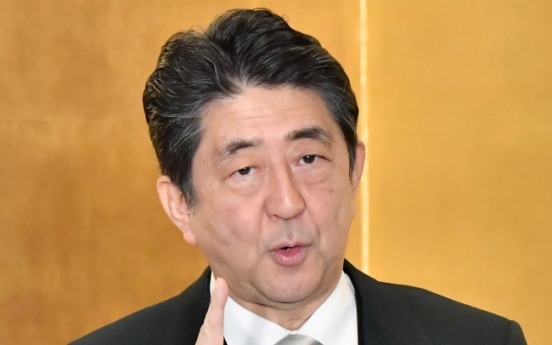 Abe rejects S. Korea's latest stance on sex slavery deal