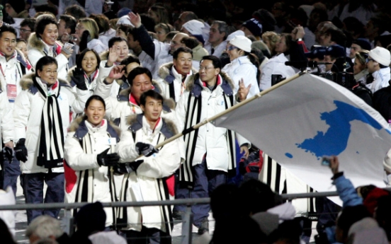 If two Koreas march together at Olympics, what flag do they raise?