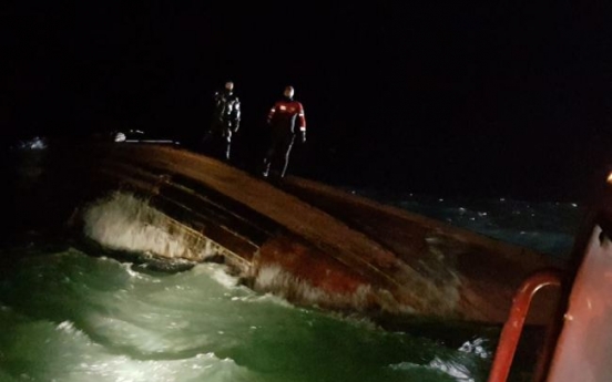 Three found dead in capsized fishing boat