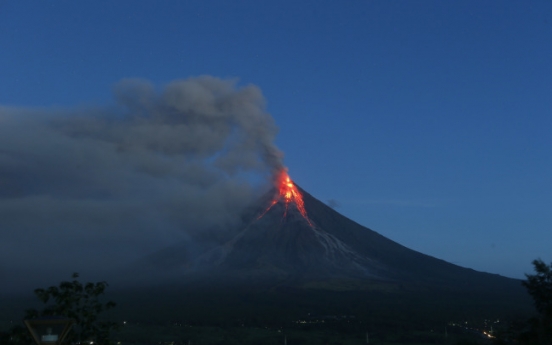 Philippine volcano spews lava fountains, 56,000 people flee