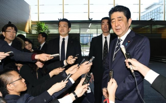 Abe to attend Olympics opening, hopes for summit with Moon