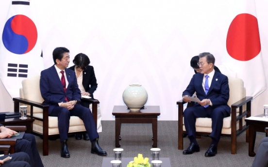 Moon, Abe confirm differences on comfort women, NK in summit