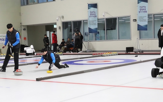 Human players beat AI robots in curling game