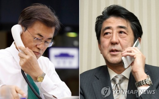 Abe wishes talks with NK during phone meeting with Moon