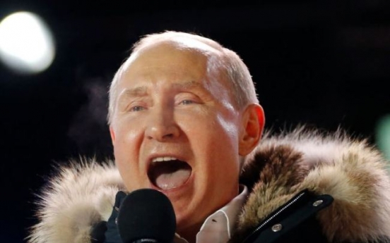 Putin claims crushing victory in Russian presidential vote