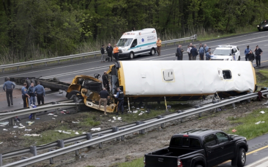 School bus torn apart in dump truck collision, killing 2