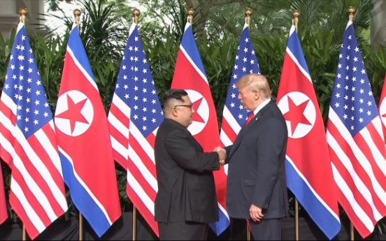 [US-NK Summit] Trump, Kim shake hands to open momentous summit