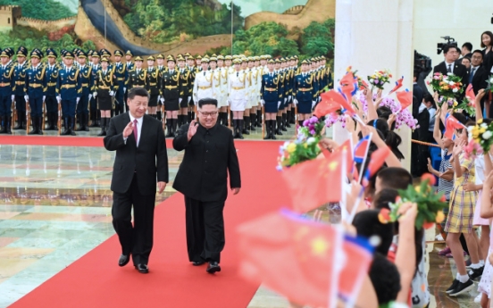 Kim, Xi discuss denuclearization, pledge closer cooperation