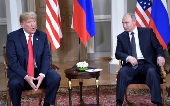 Trump, Putin sit down a bit late for closely watched summit