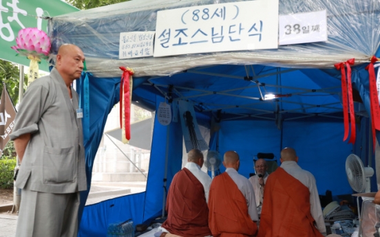 Scandal-laden chief of Korea's biggest Buddhist sect facing calls for resignation