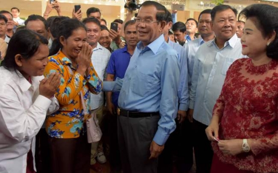 Cambodia ruling party claims 'huge victory' in vote decried as 'sham'