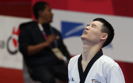 Taekwondo poomsae practitioner Kang Min-sung wins S. Korea's 1st gold