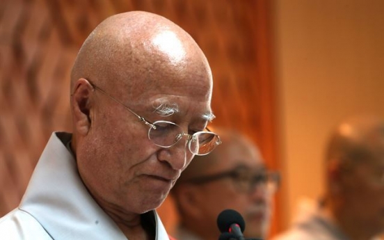 Buddhist leader resigns over corruption allegations