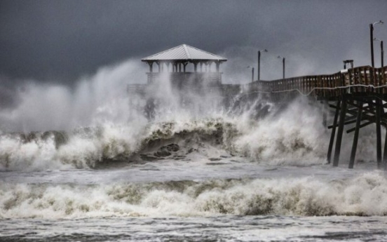 ‘Threat becomes reality’: Florence begins days of rain, wind