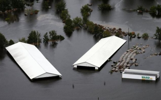 Flooding fears surge as rivers rise; Wilmington cut off