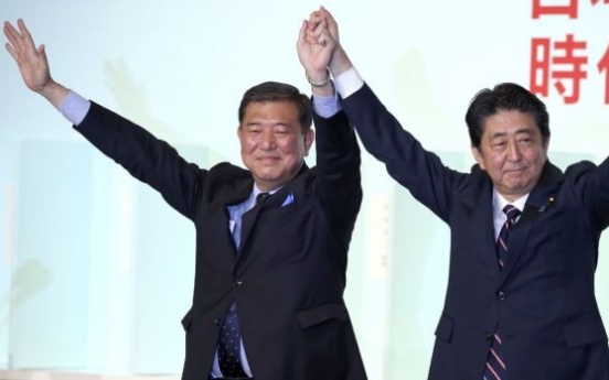 Japan’s Abe re-elected as party head, to stay on as PM