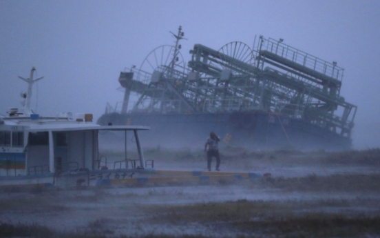 Typhoon pummels Japan; flights canceled, trains shut down