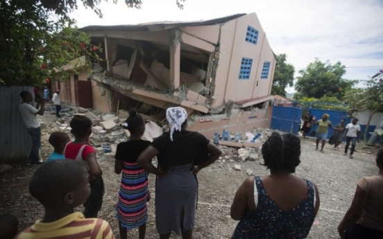 Strong aftershock rattles north Haiti day after deadly quake