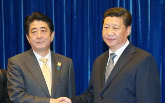 Japan's Abe in China as two nations try to mend ties