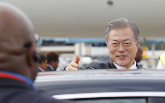 Moon returns home after APEC forum