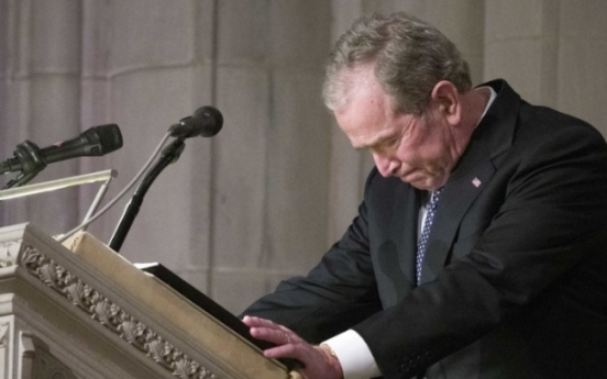 Nation bids goodbye to Bush with high praise, cannons, humor