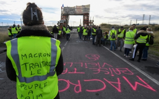 French government yields on fuel price hikes after weeks of protest