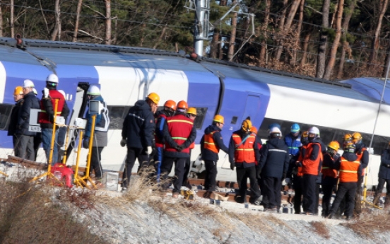 Recovery work continues on derailed KTX train site amid cold weather