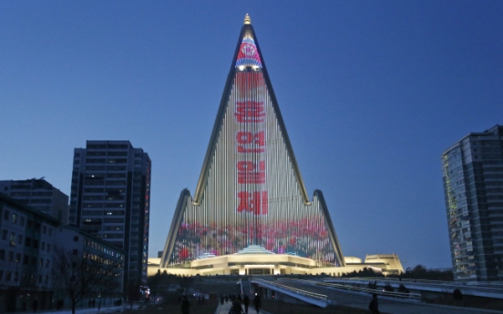 World's tallest empty hotel lit up with N. Korean propaganda