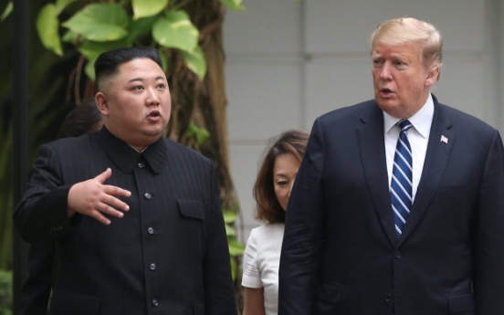 Kim, Trump seen strolling on hotel grounds