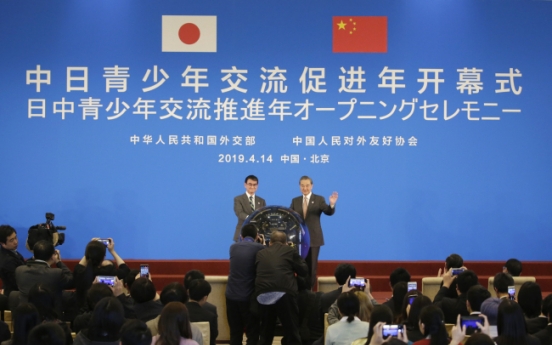 China, Japan tout 'recovered' ties amid global uncertainty