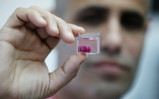 Scientists unveil 'first' 3D print of heart with human tissue, vessels