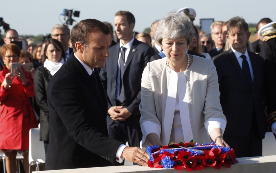 Macron praises May and looks beyond Brexit on D-Day