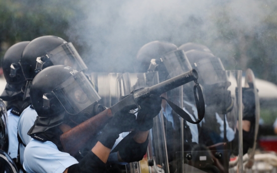 Hong Kong police use tear gas as protesters try to storm parliament