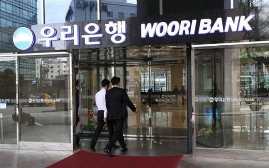 [News Focus] Government offloading Woori stakes to elevate holding company