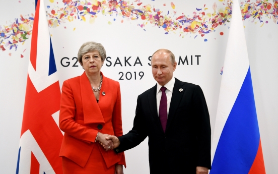 May to Putin: Stop 'destabilising' UK, allies