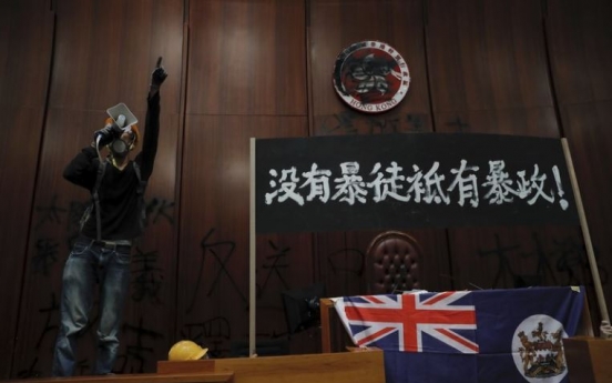 Riot police clear away protests from Hong Kong legislature