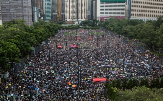 Hong Kong protesters flood city streets in 'peaceful' march