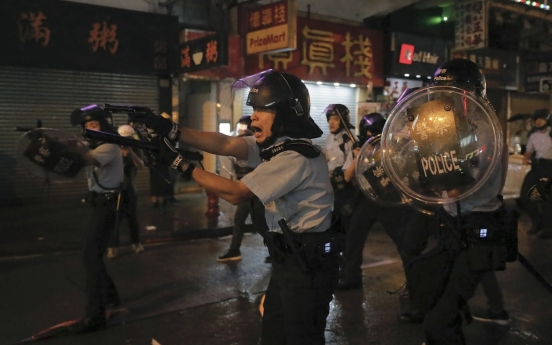 Hong Kong police fire first gunshot, water cannon in protest clashes