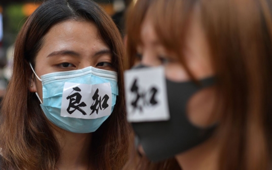 Hong Kong leader bans masks in hardening stance on protests