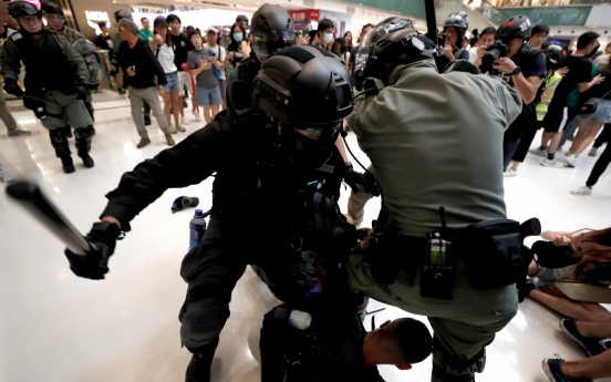 Five wounded as knife attack caps day of Hong Kong political chaos