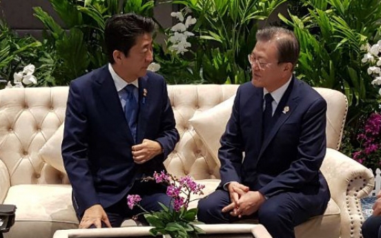 Moon, Abe agree to seek resolution to trade issues