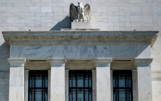 US Fed says will focus on low inflation, global economy