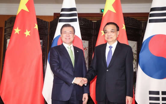 Moon, Li agree to facilitate follow-up FTA talks on service, investment sectors