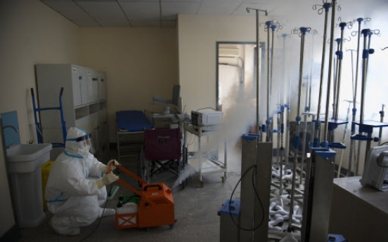 Wuhan offers hope on virus front; Italy nears stark toll