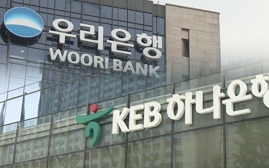 Financial watchdog warns Woori, Hana over board infractions